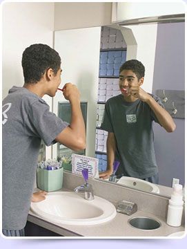 A boy brushing his teeth